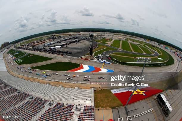 Trucks race during the NASCAR Gander Outdoors Truck Series Vet Tix Camping World 200 at Atlanta Motor Speedway on June 06, 2020 in Hampton, Georgia.