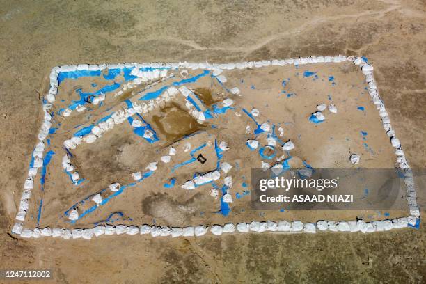 An aerial picture shows a general view of the newly-excavated trench which may have contained an inn with a cooling area for food storage, at the...