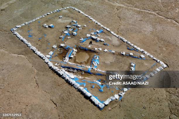 An aerial picture shows a general view of the newly-excavated trench which may have contained an inn with a cooling area for food storage, at the...