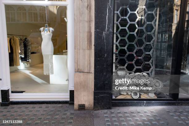 Closed down retail space next to an open boutique on Bond Street on 6th Febuary 2023 in London, United Kingdom. Bond Street is one of the principal...
