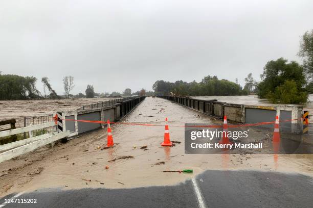 Redcliffe Bridge is closed off as debris piles up along the Tutaekuri River in the suburb of Taradale on February 14, 2023 in Napier, New Zealand....