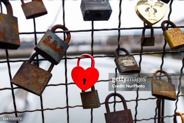 Love padlocks are seen at Father Bernatek Footbridge over Vistula River, which is known as the lovers bridge. Krakow, Poland on February 13, 2023.