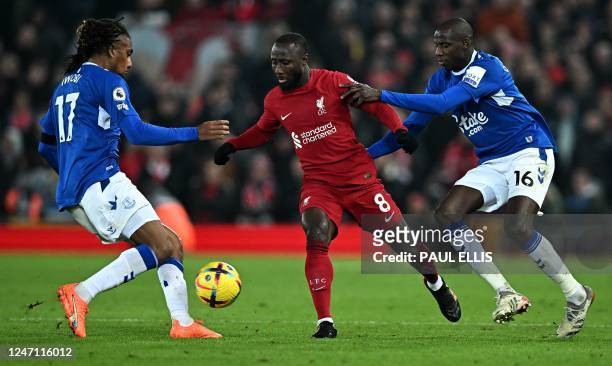 Liverpool's Guinean midfielder Naby Keita vies with Everton's Nigerian midfielder Alex Iwobi and Everton's French midfielder Abdoulaye Doucoure...