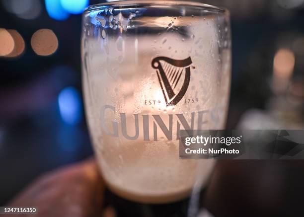 Pint of Guinness on the table inside a pub in Dublin, Ireland, on February 12, 2023.