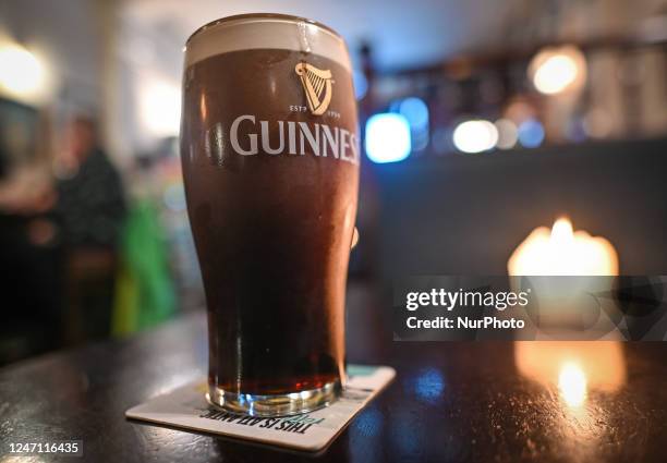 Perfect pint of Guinness on the table inside a pub in Dublin, Ireland, on February 12, 2023.