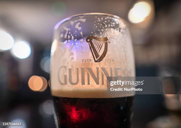 Perfect pint of Guinness on the table inside a pub in Dublin, Ireland, on February 12, 2023.