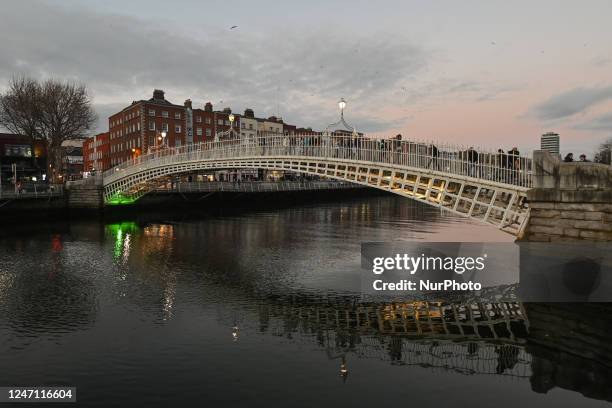 View of the Ha'penny Bridge in Dublin city center, Ireland, on February 12, 2023.