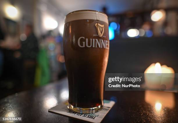 Perfect pint of Guinness on the table inside a pub in Dublin, Ireland, on February 12, 2023.