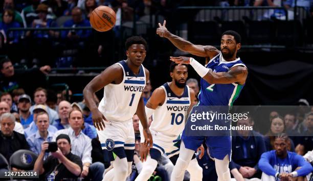 Kyrie Irving of the Dallas Mavericks makes a no look pass against the Minnesota Timberwolves in the first half at American Airlines Center on...