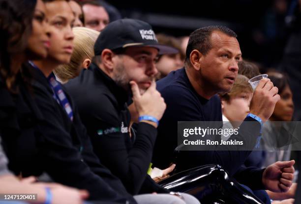 Baseball analyst and former MLB player Alex Rodriguez watches the game between the Dallas Mavericks and the Minnesota Timberwolves in the first half...