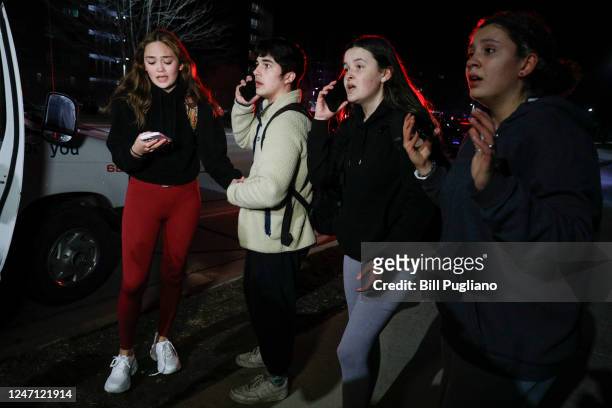 Michigan State University students react during an active shooter situation on campus on February 13, 2023 in East Lansing, Michigan. Five people...