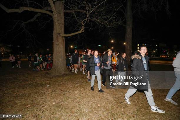 Michigan State University students evacuate to a safe area during an active shooter situation on campus on February 13, 2023 in East Lansing,...