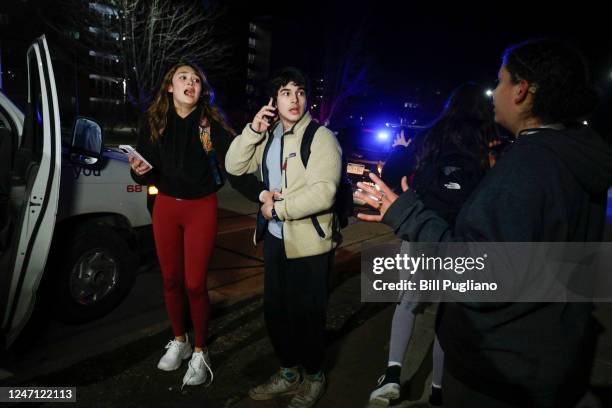 Michigan State University students react during an active shooter situation on campus on February 13, 2023 in East Lansing, Michigan. Five people...