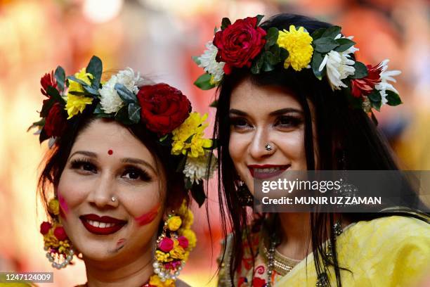 Women wearing traditional attires take part in a ceremony on the occasion of 'Basanta Utsab', or the Spring Festival, in Dhaka on February 14, 2023.