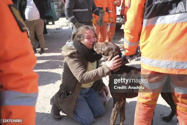 Woman asks for help from a rescue dog to find her loved ones as search and rescue efforts continue after the powerful twin earthquakes hit Turkiye's...