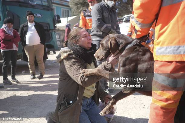 Woman asks for help from a rescue dog to find her loved ones as search and rescue efforts continue after the powerful twin earthquakes hit Turkiye's...