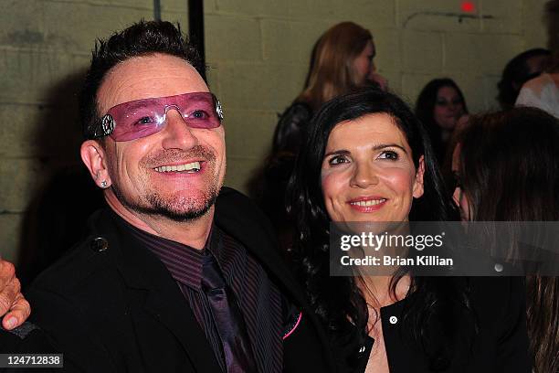 Bono and Alison Hewson attend the Edun Spring 2012 fashion show during Mercedes-Benz Fashion Week at 330 West Street on September 11, 2011 in New...