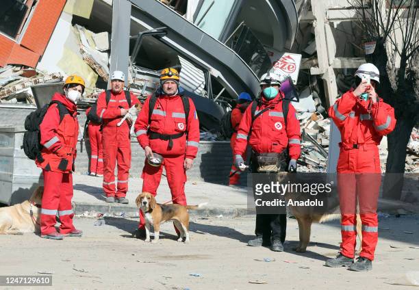 Romanian rescuers attend search and rescue efforts on collapsed buildings after the powerful twin earthquakes hit Turkiye's Hatay on February 14,...