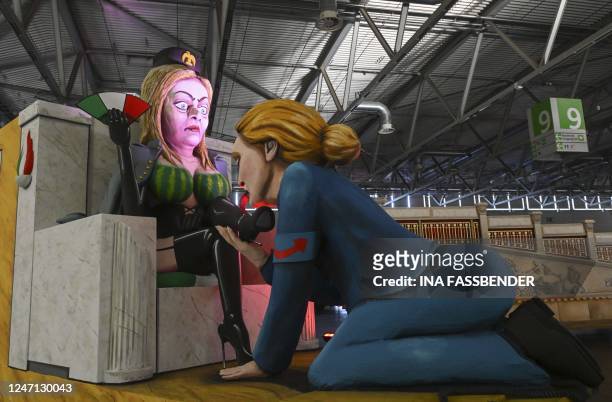 Carnival float featuring the co-leader of Germany's far-right Alternative for Germany party Alice Weidel kneeling down to lick the shoes of Italy's...
