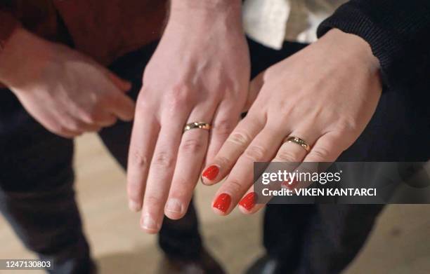Bizzy Klein and Robert Djurberg present their wedding rings following their wedding ceremony at The Vasa Museum in Stockholm, Sweden on Valentine's...