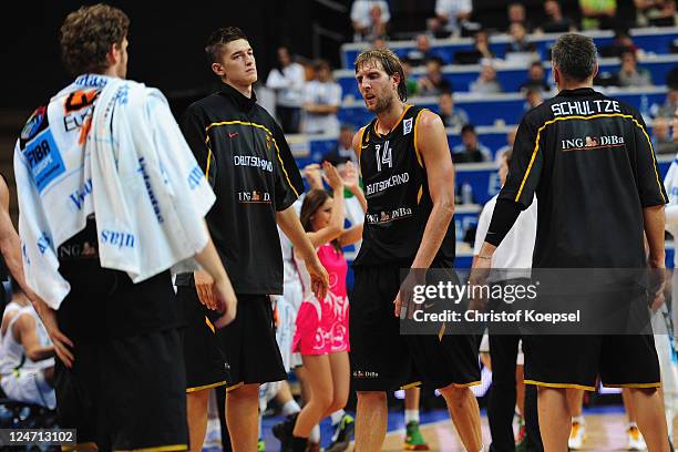 Tibor Pleiss, Tim Ohlbrecht, Dirk Nowitzki and Sven Schultze of Germany look dejected during the EuroBasket 2011 second round group E match between...