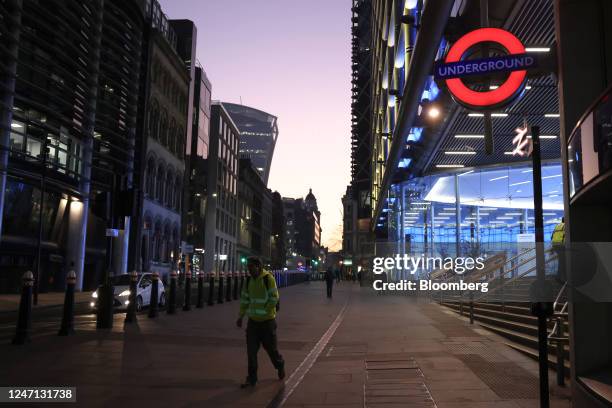 Commuters exit Cannon Street Underground Station in the City of London, UK, on Tuesday, Feb. 14, 2023. UK wages rose quicker than expected at the end...