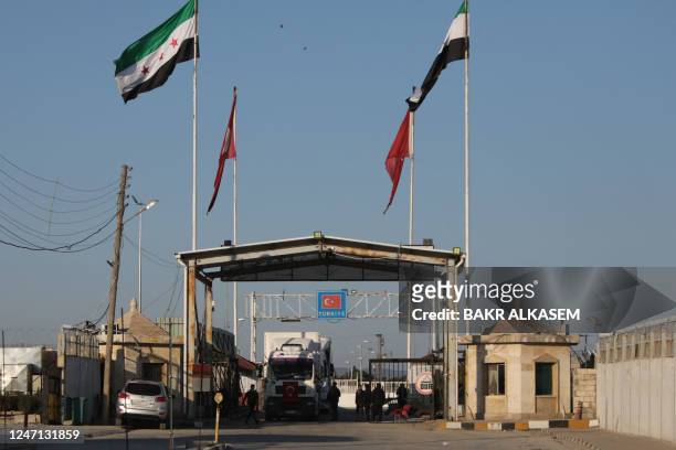 Truck part of an aid convoy crosses from Turkey into rebel-held north Syria through the Bab al-Salama crossing on February 14 after it reopened for...