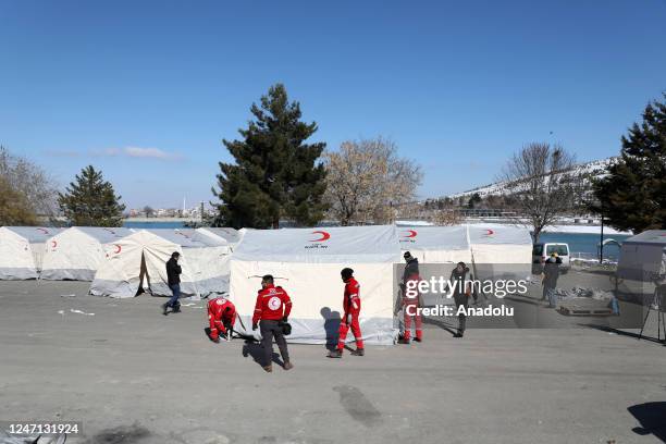 Palestinian search and rescue team members and Turkish Red Crescent teams set up tents after 7.7 and 7.6 magnitude earthquakes hit multiple provinces...