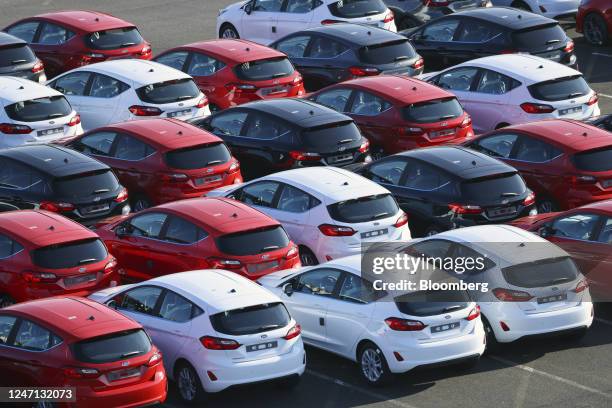 Lines of new Ford Fiesta automobiles in a lot at the Ford Motor Co. Plant in Cologne, Germany, on Tuesday, Feb. 14, 2023. Ford will dismiss some 11%...