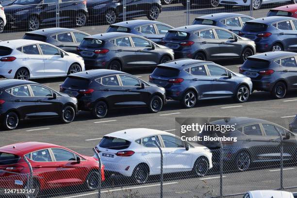 Lines of new Ford Fiesta automobiles in a lot at the Ford Motor Co. Plant in Cologne, Germany, on Tuesday, Feb. 14, 2023. Ford will dismiss some 11%...