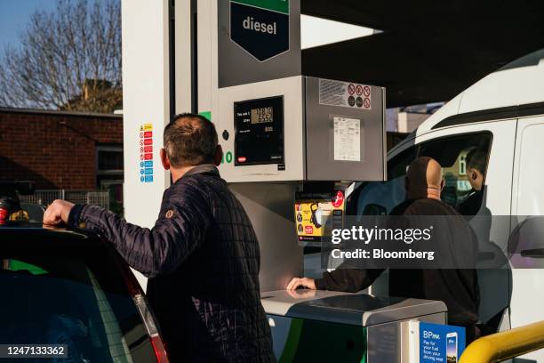 Customers use fuel pumps at a BP Plc petrol station in London, UK, on Tuesday, Feb. 14, 2023. The Office for National Statistics are due to release...