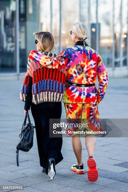 Influencer Gitta Banko, wearing a multicolored striped vest by Majami, a black long dress by Victoria Beckham, sunglasses by Bottega veneta and a...