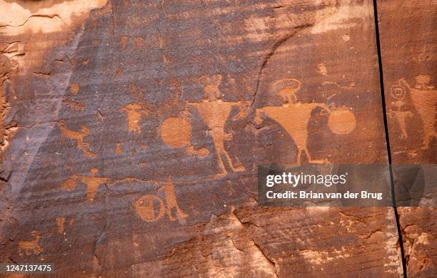 Rock panel of petroglyphs along Highway 279 near Moab in an area of a canyon that resembled Glen Canyon in the 1960s before Lake Powell was filled...