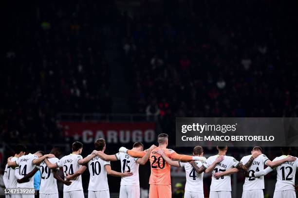 Tottenham players unite to observe a minute's silence to commemorate the victims of the earthquake that struck Turkey and Syria, prior to the UEFA...