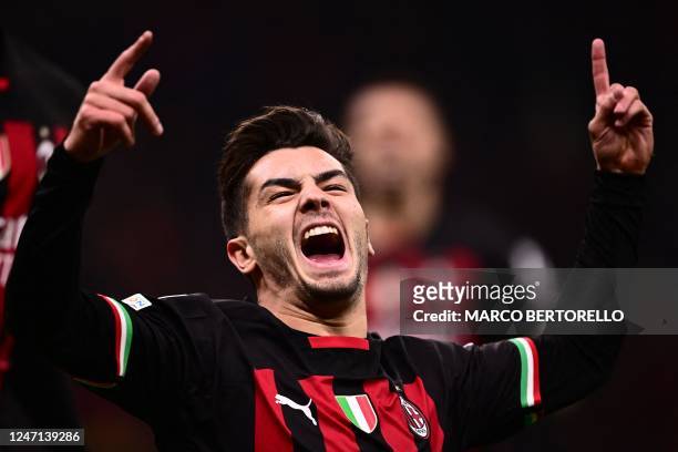 Milan's Spanish midfielder Brahim Diaz celebrates after opening the scoring during the UEFA Champions League round of 16, first leg football match...