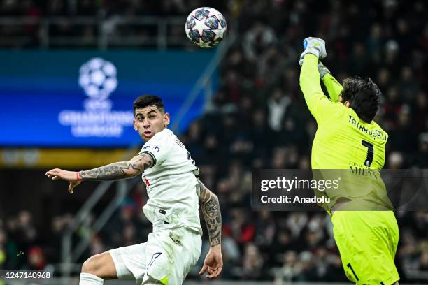 Cristian Romero of Tottenham Hotspur in action against Ciprian Tatarusanu of AC Milan during the UEFA Champions League football match between AC...