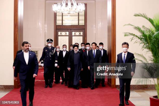 Iranian President Ebrahim Raisi meets with Chairman of the Standing Committee of the National People's Congress of China Li Zhanshu during his...