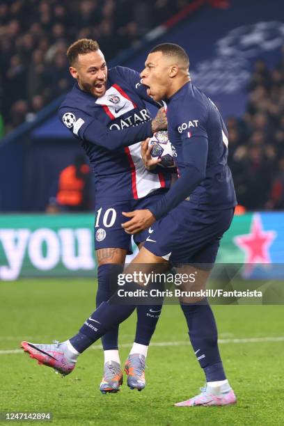 Kylian Mbappe of Paris Saint-Germain celebrates scoring the second of two disallowed goals with Neymar during the UEFA Champions League round of 16...