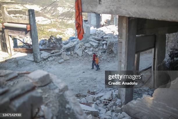 Personnel and civilians conduct search and rescue operations on collapsed buildings in Idlib, Syria after 7.7 and 7.6 magnitude earthquakes hit...