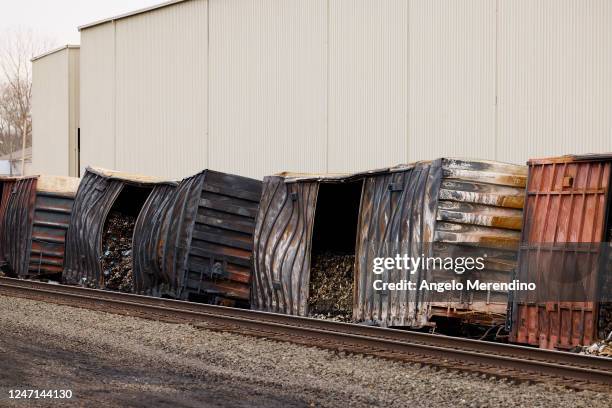 Charred train cars sit near railroad tracks on February 14, 2023 in East Palestine, Ohio. The Norfolk Southern train derailed on February 3,...