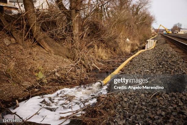 Water is rerouted near the site of a train derailment on February 14, 2023 in East Palestine, Ohio. A train operated by Norfolk Southern derailed on...