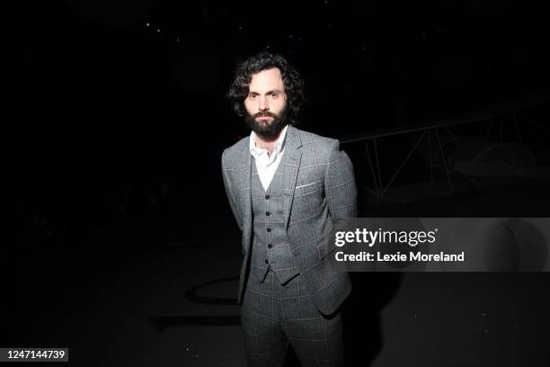 Penn Badgley in the front row at Thom Browne Fall 2023 Ready To Wear Fashion Show at The Shed on February 14, 2023 in New York, New York.