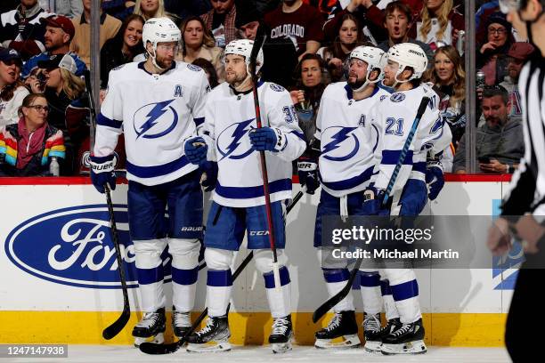 Victor Hedman, Brandon Hagel, Nikita Kucherov and Brayden Point of the Tampa Bay Lightning celebrate a goal against the Colorado Avalanche at Ball...