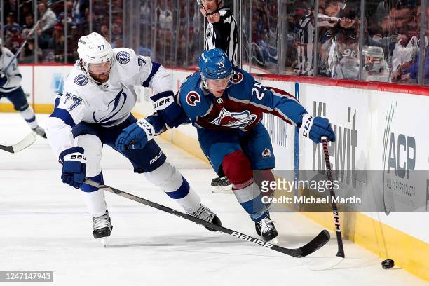 Logan O'Connor of the Colorado Avalanche skates against Victor Hedman of the Tampa Bay Lightning at Ball Arena on February 14, 2023 in Denver,...