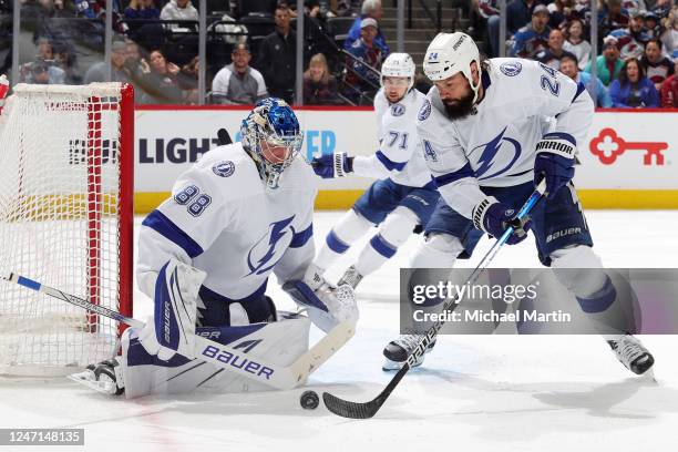 Zach Bogosian and goaltender Andrei Vasilevskiy of the Tampa Bay Lightning defend against the Colorado Avalanche at Ball Arena on February 14, 2023...