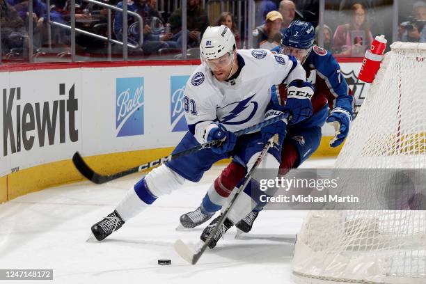 Erik Cernak of the Tampa Bay Lightning skates against Devon Toews of the Colorado Avalanche at Ball Arena on February 14, 2023 in Denver, Colorado.