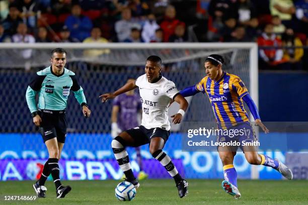 Pedro Aquino of America competes for the ball with Angel Zaldivar of Atletico San Luis during the 7th round match between Atletico San Luis and...