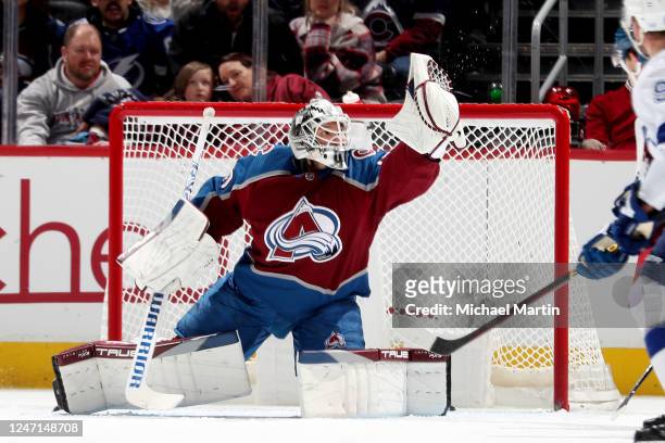 Goaltender Alexandar Georgiev of the Colorado Avalanche makes a glove save against the Tampa Bay Lightning at Ball Arena on February 14, 2023 in...
