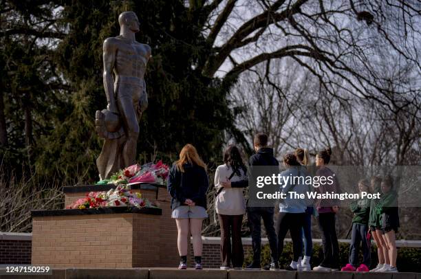 February 14: People embrace at the memorial that formed around The Spartan Statue at Michigan State University in East Lansing, Michigan on Februrary...