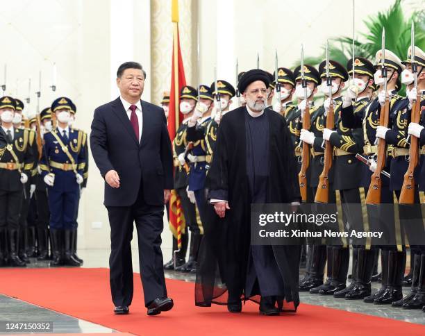 Chinese President Xi Jinping holds a welcoming ceremony for visiting President of the Islamic Republic of Iran Ebrahim Raisi prior to their talks at...